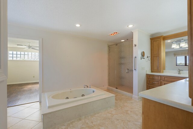 full bath featuring vanity, crown molding, a stall shower, and tile patterned floors