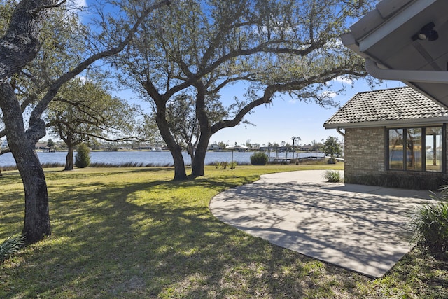 view of yard with a water view