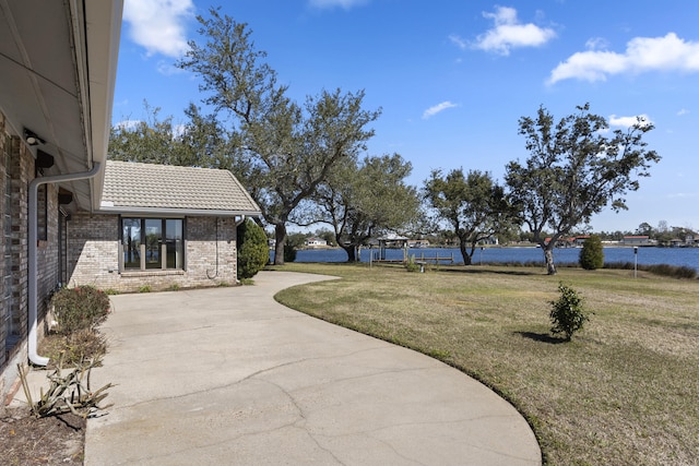 view of yard with a water view