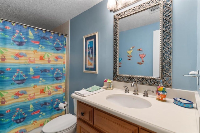 bathroom with a textured ceiling, curtained shower, toilet, vanity, and visible vents