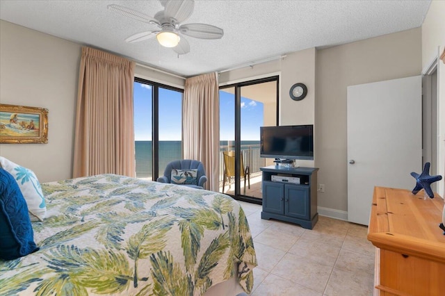 bedroom with access to exterior, light tile patterned floors, ceiling fan, a textured ceiling, and baseboards