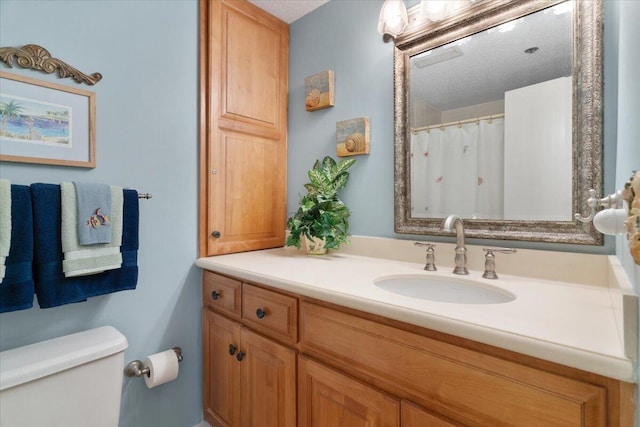 full bath with vanity and toilet