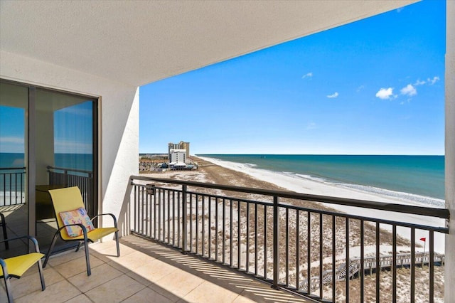 balcony with a view of the beach and a water view