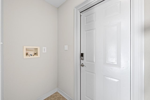 laundry area with laundry area, washer hookup, and baseboards