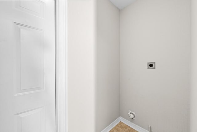 washroom featuring laundry area, hookup for an electric dryer, and baseboards