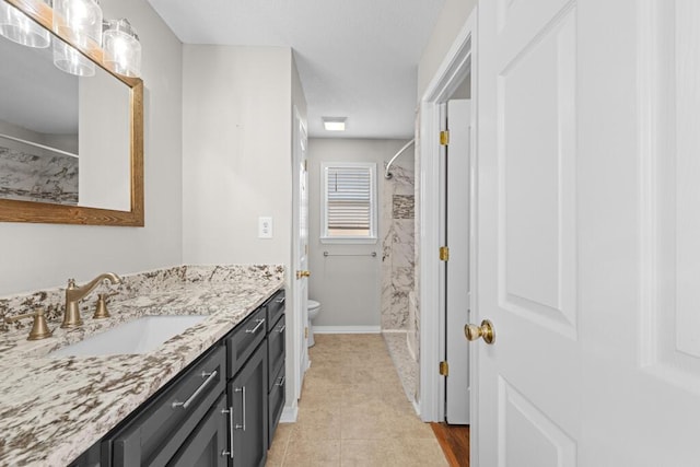 full bathroom featuring baseboards, toilet, curtained shower, tile patterned flooring, and vanity