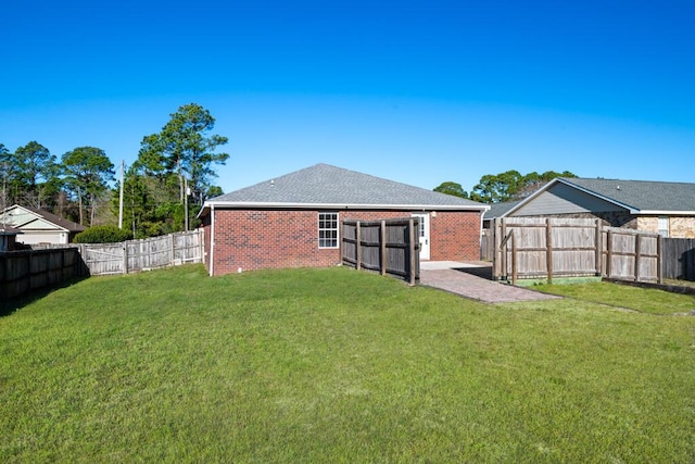 view of yard with a fenced backyard