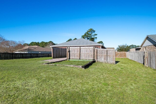 view of yard with a fenced backyard