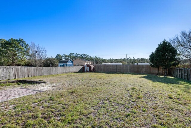 view of yard with a fenced backyard