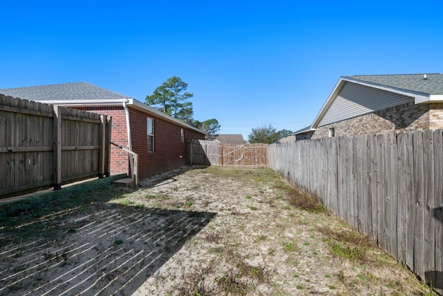 view of yard featuring a fenced backyard