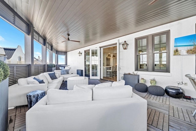 sunroom / solarium with wood ceiling and ceiling fan