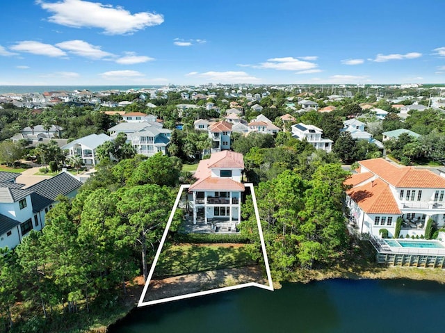 bird's eye view with a residential view and a water view