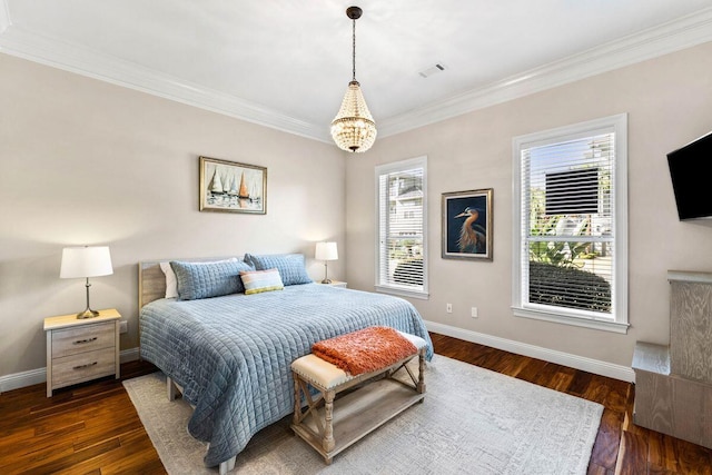 bedroom with dark wood-style flooring, visible vents, crown molding, and baseboards