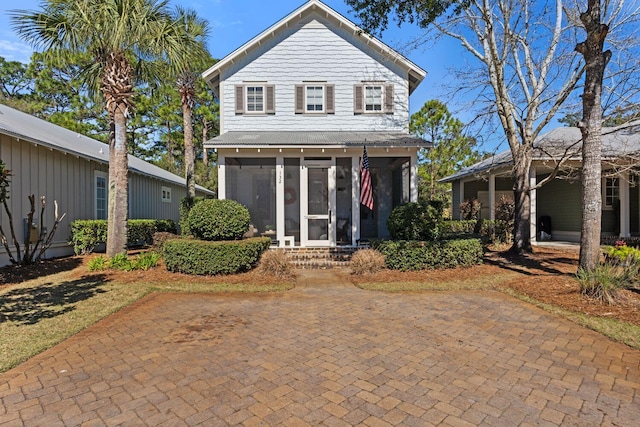 view of front of property with a sunroom