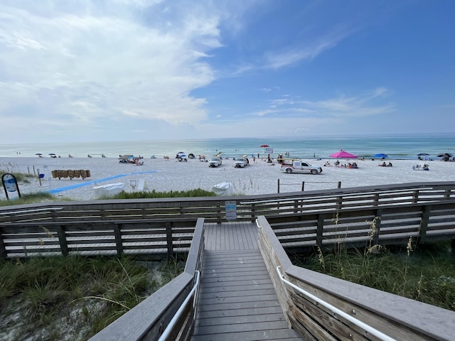 view of community with a view of the beach and a water view