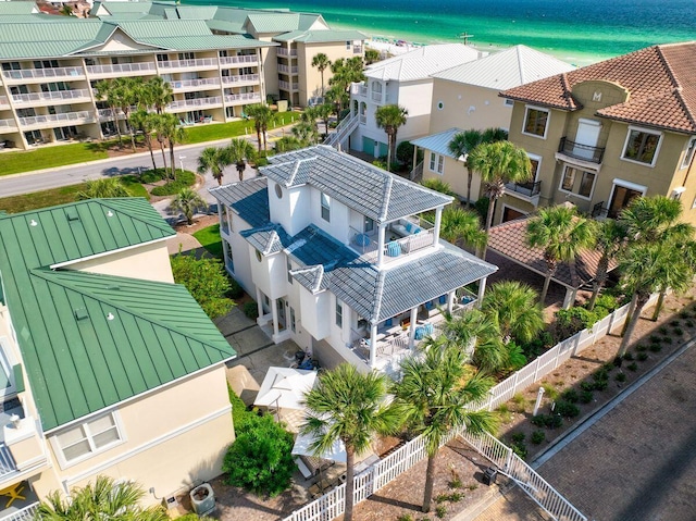 drone / aerial view featuring a water view and a residential view