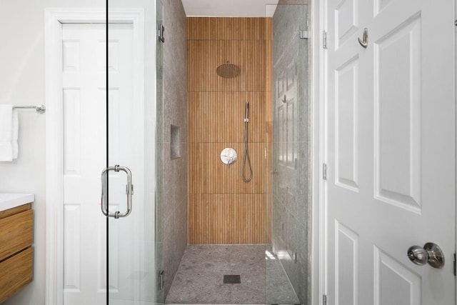 bathroom featuring a stall shower and vanity