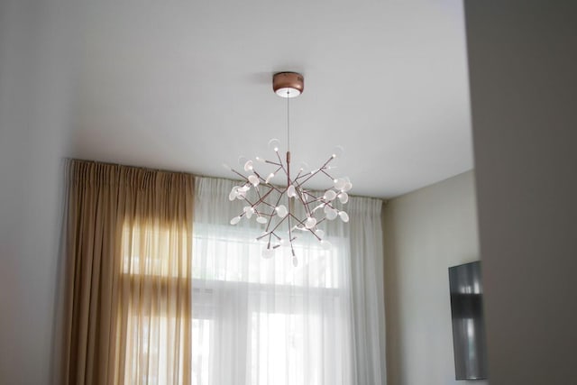 interior details featuring a notable chandelier