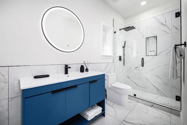 full bath featuring marble finish floor, a marble finish shower, recessed lighting, toilet, and vanity