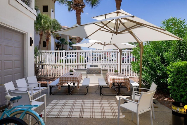 view of patio featuring a grill