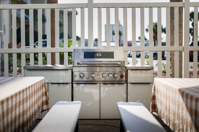 exterior space with an outdoor kitchen and area for grilling