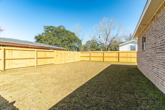 view of yard with a fenced backyard