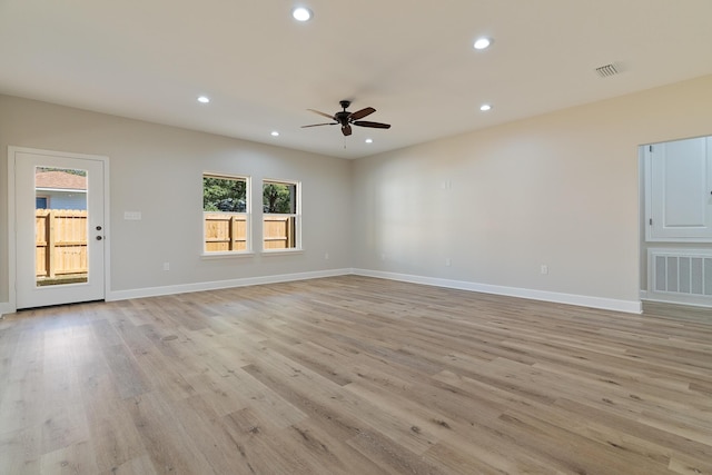 unfurnished living room featuring light wood-style floors, baseboards, visible vents, and recessed lighting