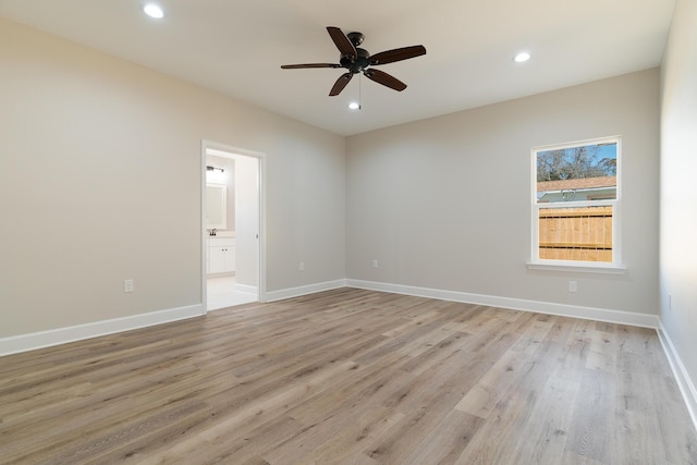 empty room with baseboards, ceiling fan, recessed lighting, and light wood-style floors