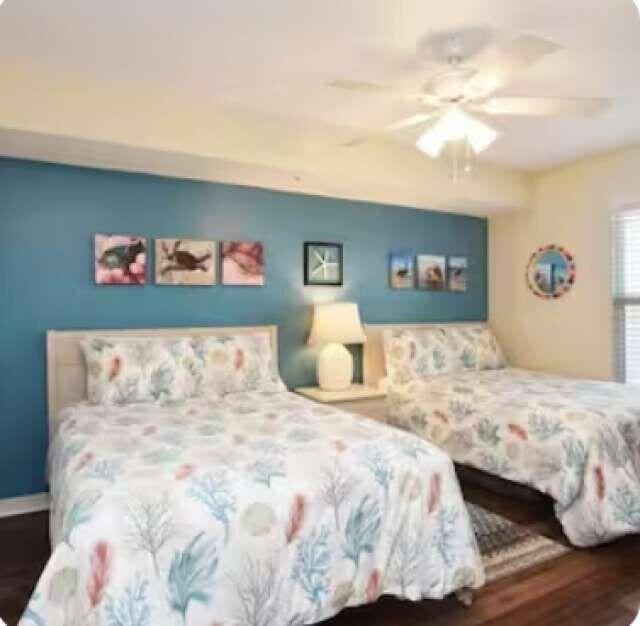 bedroom featuring ceiling fan and wood finished floors