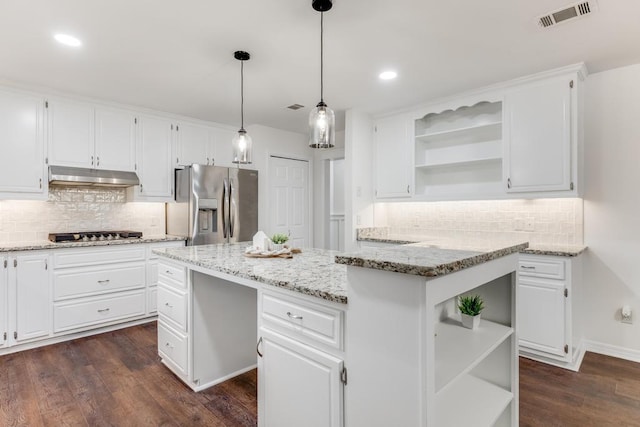 kitchen with open shelves, stainless steel appliances, under cabinet range hood, and visible vents