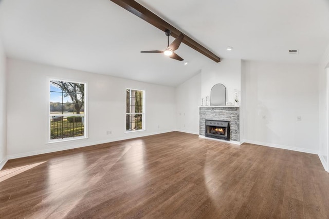 unfurnished living room with a fireplace, vaulted ceiling with beams, baseboards, and wood finished floors