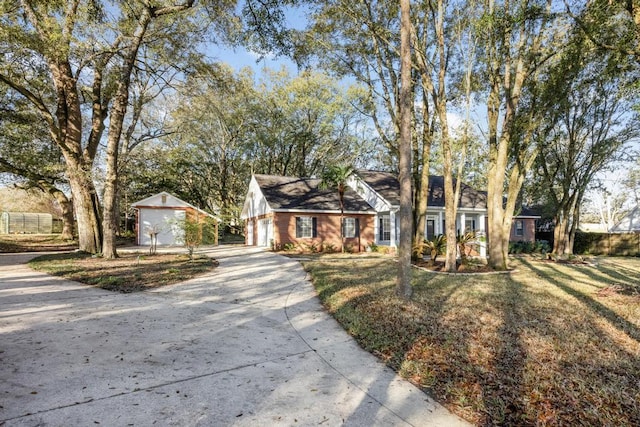 ranch-style house featuring brick siding, a front lawn, concrete driveway, and a garage