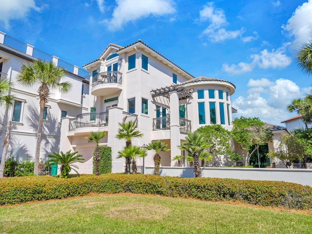 mediterranean / spanish-style home featuring a tile roof and stucco siding