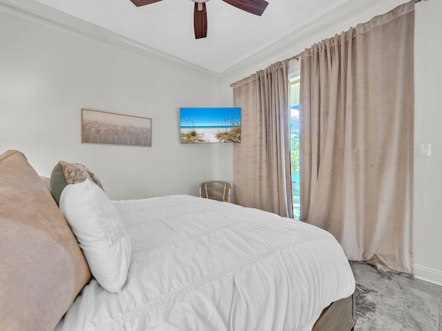 bedroom with baseboards, a ceiling fan, and crown molding