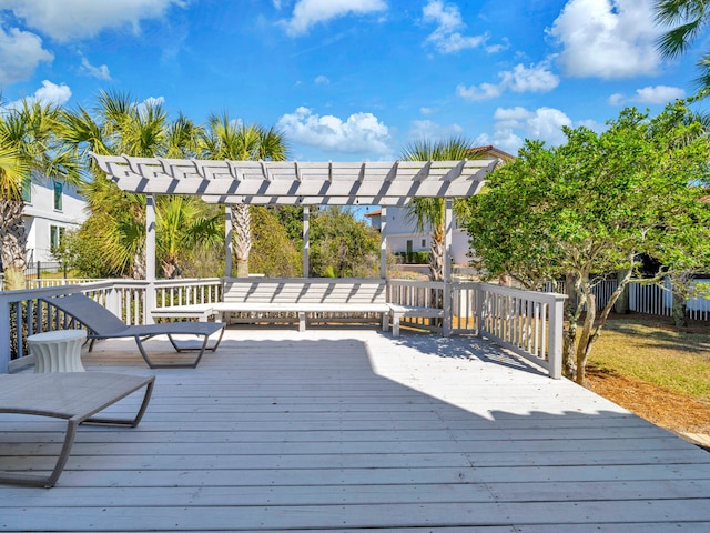 deck featuring fence and a pergola