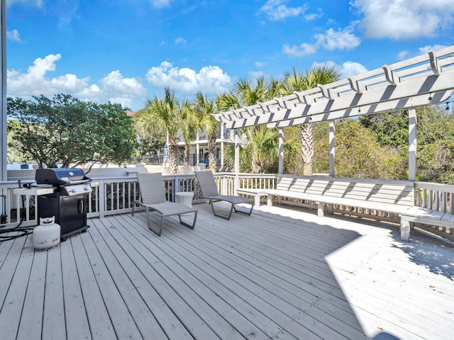 deck with a pergola and area for grilling