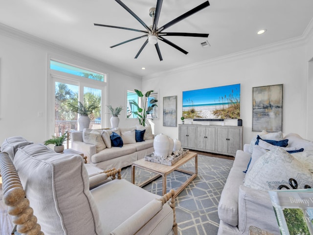 living area featuring a ceiling fan, recessed lighting, visible vents, and crown molding