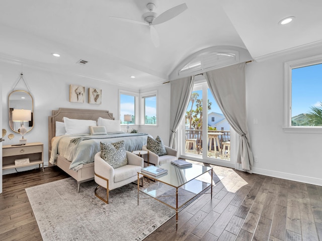 bedroom featuring baseboards, multiple windows, wood finished floors, and access to exterior