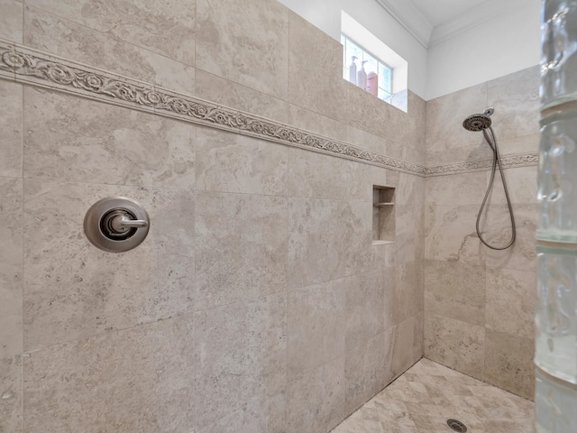 full bathroom with a tile shower and crown molding