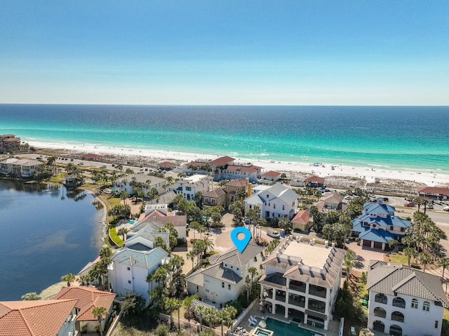 bird's eye view with a water view, a residential view, and a view of the beach