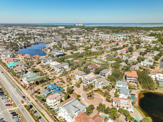 bird's eye view with a residential view and a water view