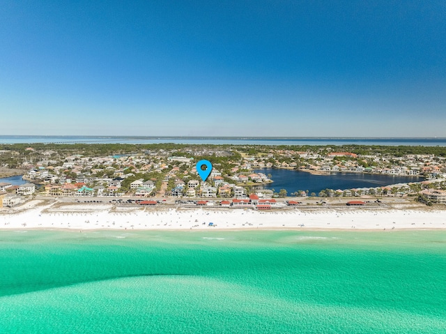 bird's eye view featuring a water view and a view of the beach