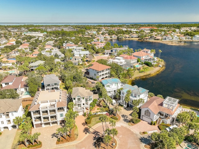 birds eye view of property with a residential view and a water view