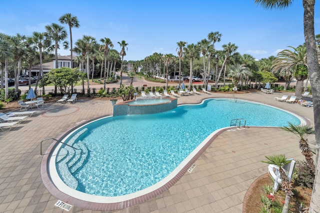 view of swimming pool with a patio area