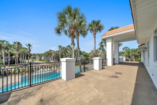 view of patio with a fenced in pool