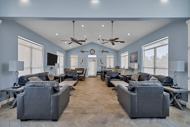 living area with baseboards, high vaulted ceiling, and recessed lighting