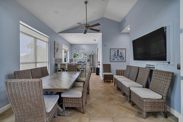 dining space with high vaulted ceiling, recessed lighting, a ceiling fan, and baseboards