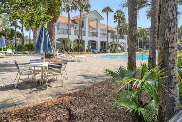 pool with a patio area