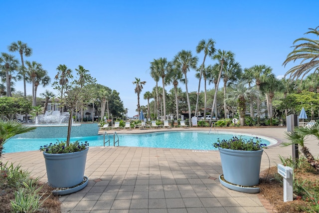 community pool with a patio