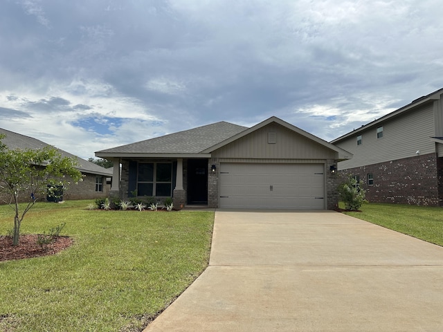 view of front of house featuring a garage, driveway, a front lawn, and brick siding